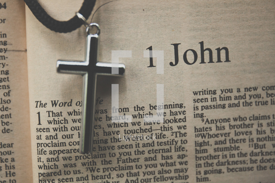 1 John and a cross necklace 