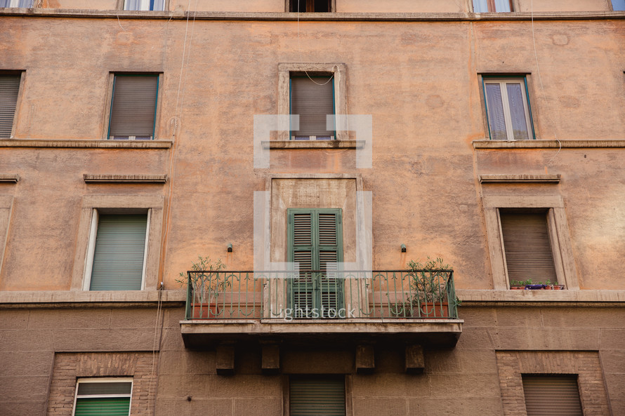 terrace and windows on the side of a building in Rome