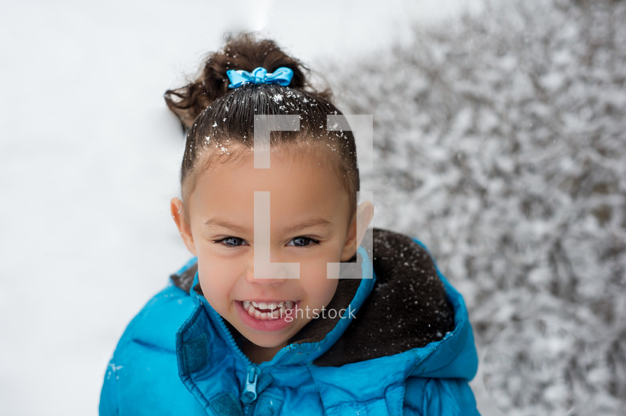 happy girl child in the snow