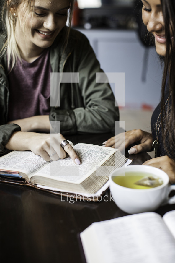 girls reading Bibles at a Bible study 
