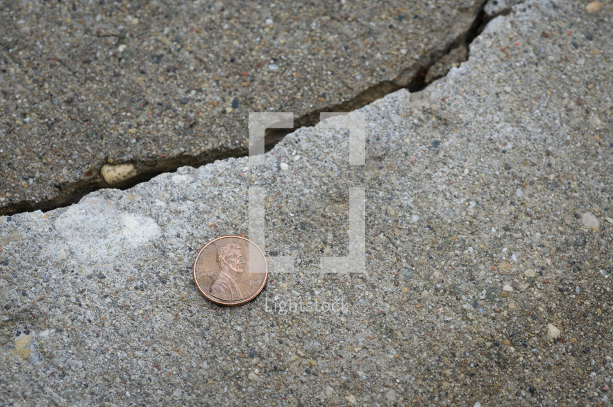 penny on the sidewalk