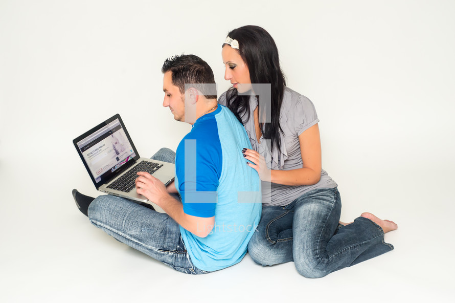 a couple at a computer 