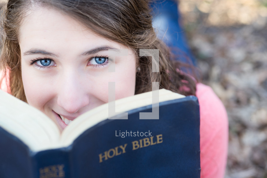 teen girl reading the Bible