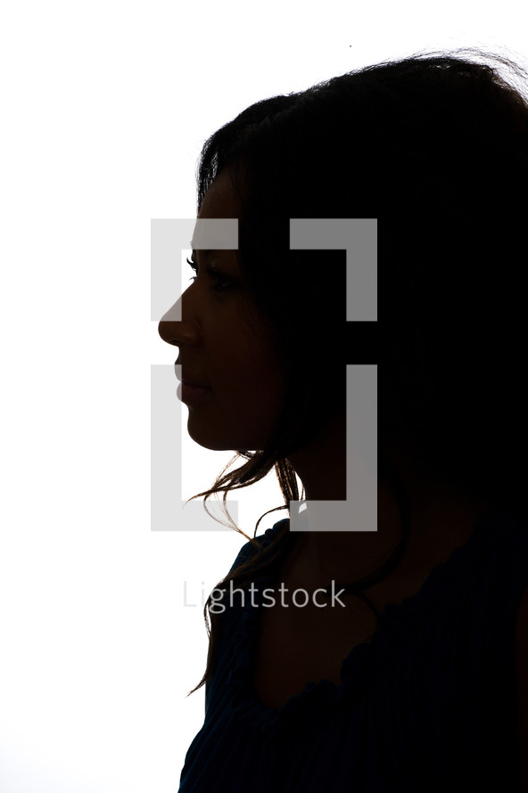 Silhouette of the profile of a woman.