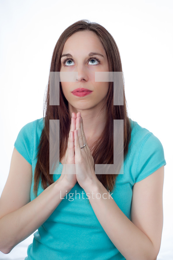 woman in prayer looking up to God
