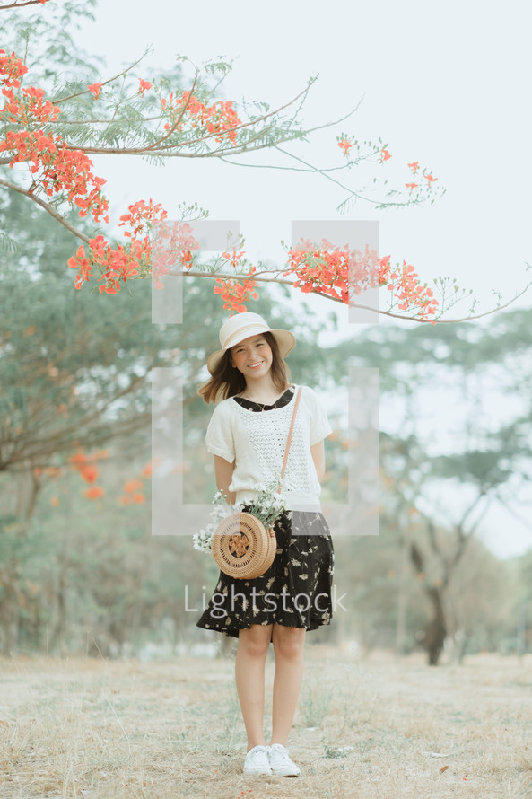 portrait of a young woman in a straw hat 