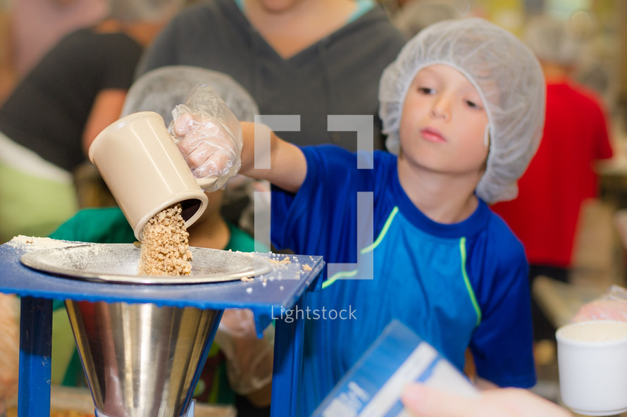 children helping in a food kitchen 