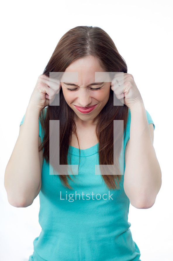 woman plugging her ears