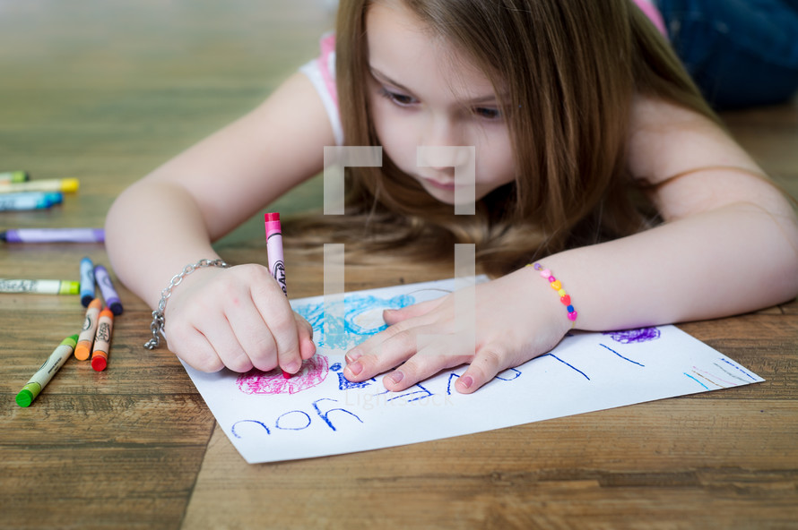 little girl making a card