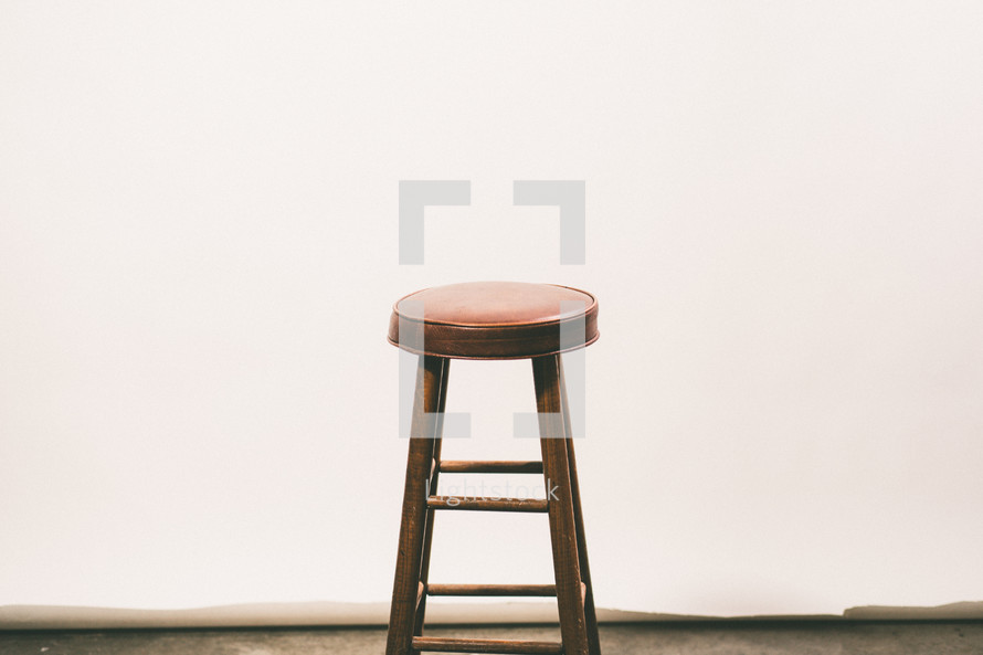a stool in an empty room 