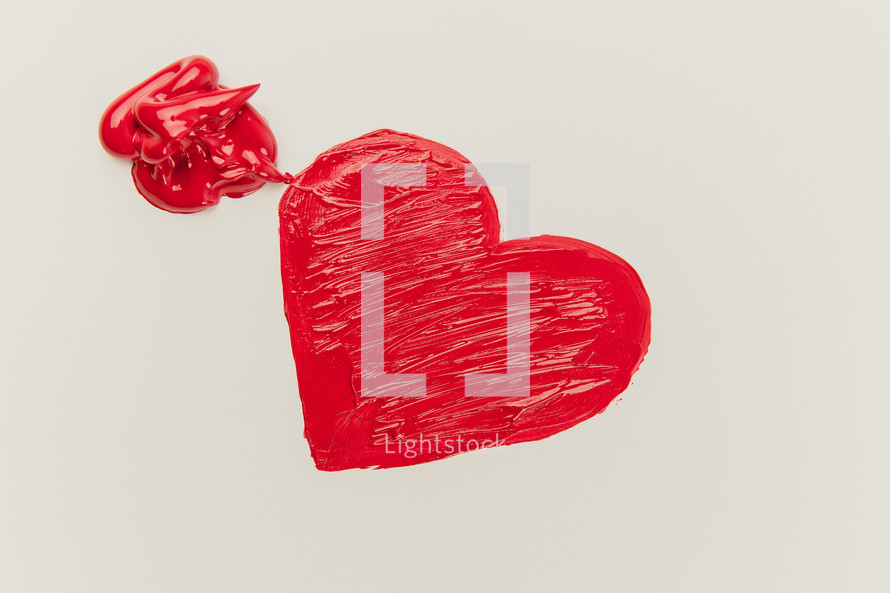 a red heart on white paper 