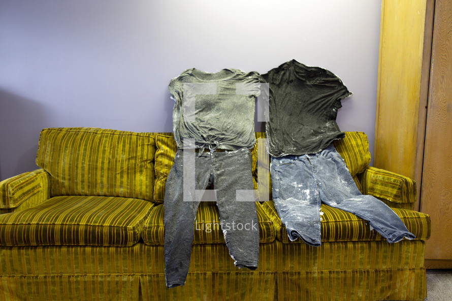 clothes frozen in place on a couch 