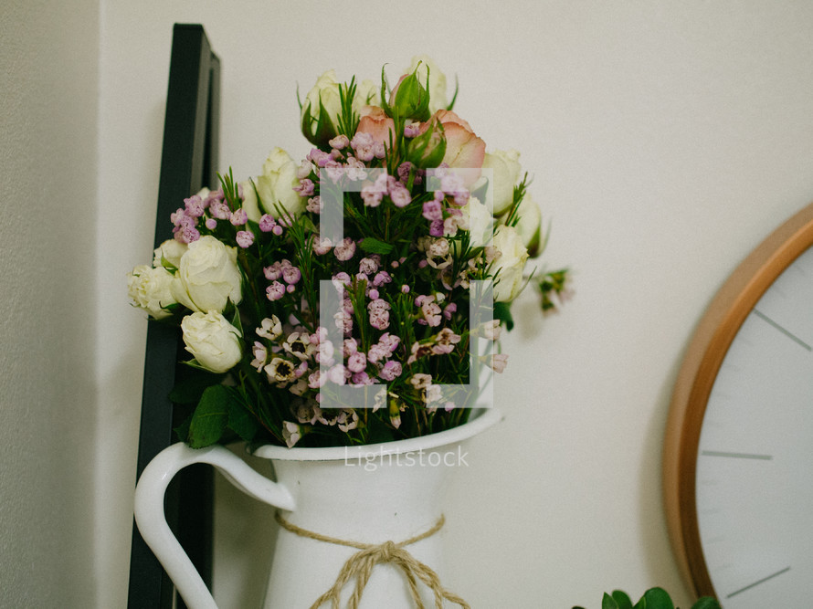flowers in a white pitcher 