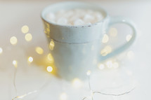 fairy lights and mug of hot cocoa 