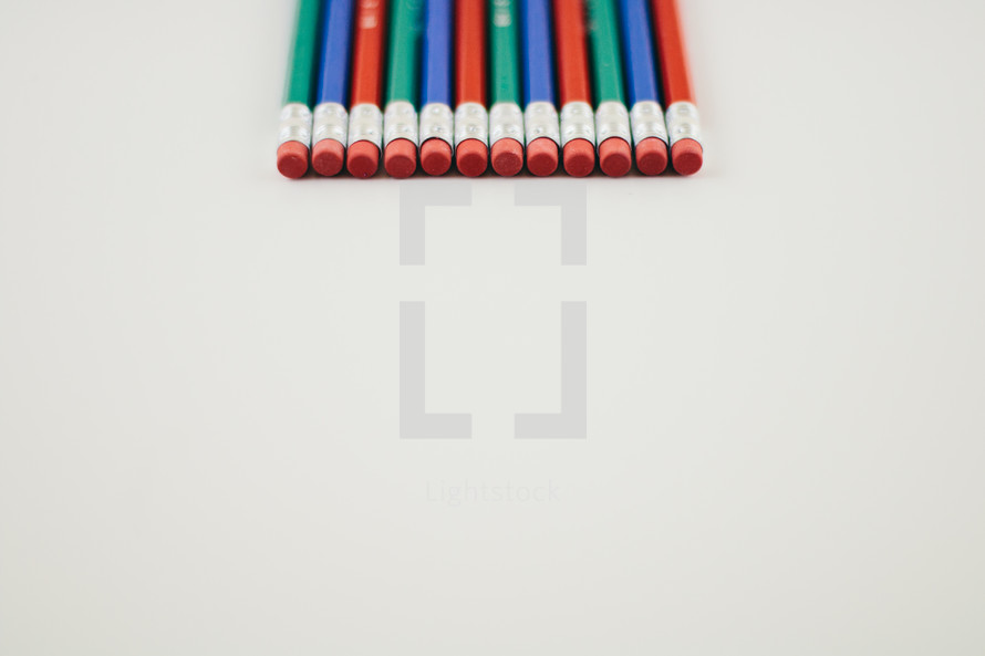pencil erasers on white background 
