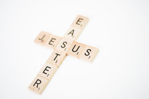 Cross of scrabble pieces forming the words Jesus and Easter