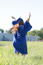 dancing in a field outside the school on graduation day