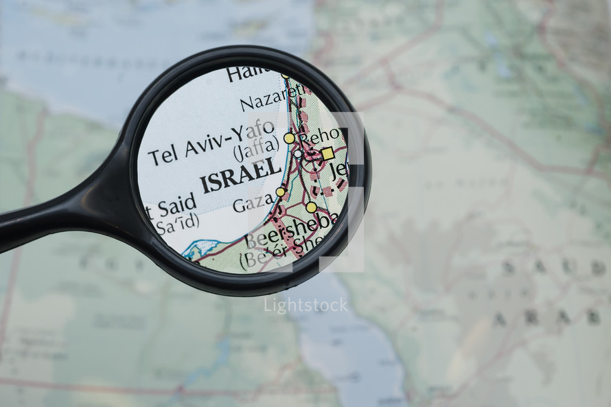 magnifying glass over a map of Israel 
