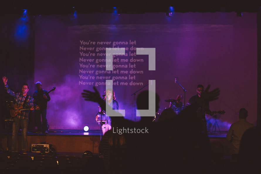 songs on a  projection screen during a worship service 