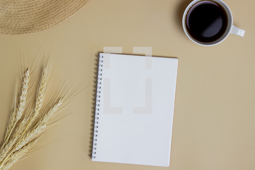 wheat, coffee cup, and journal 
