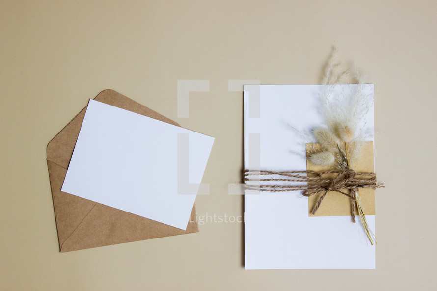 envelope with twine and fuzzy grasses 