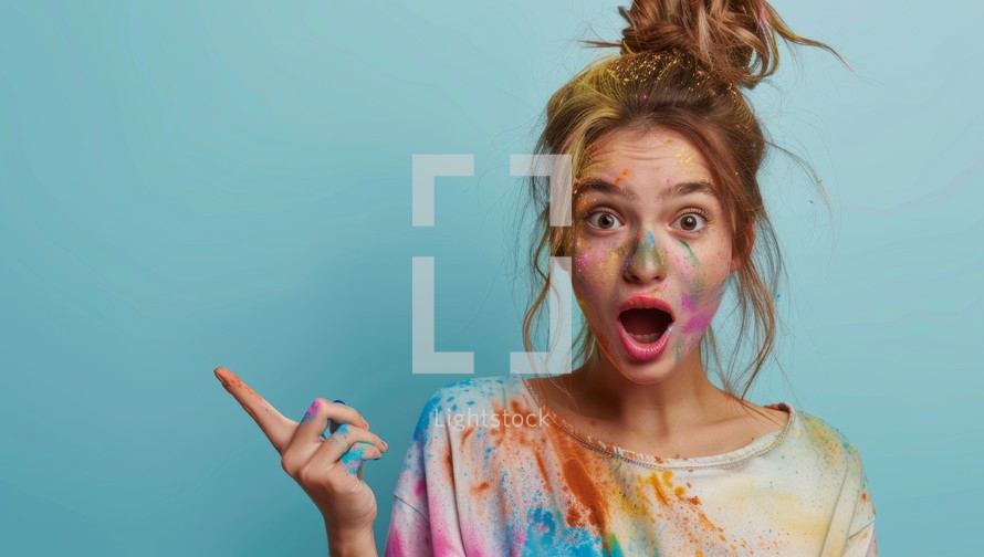 Surprised woman covered in colorful powder paint
