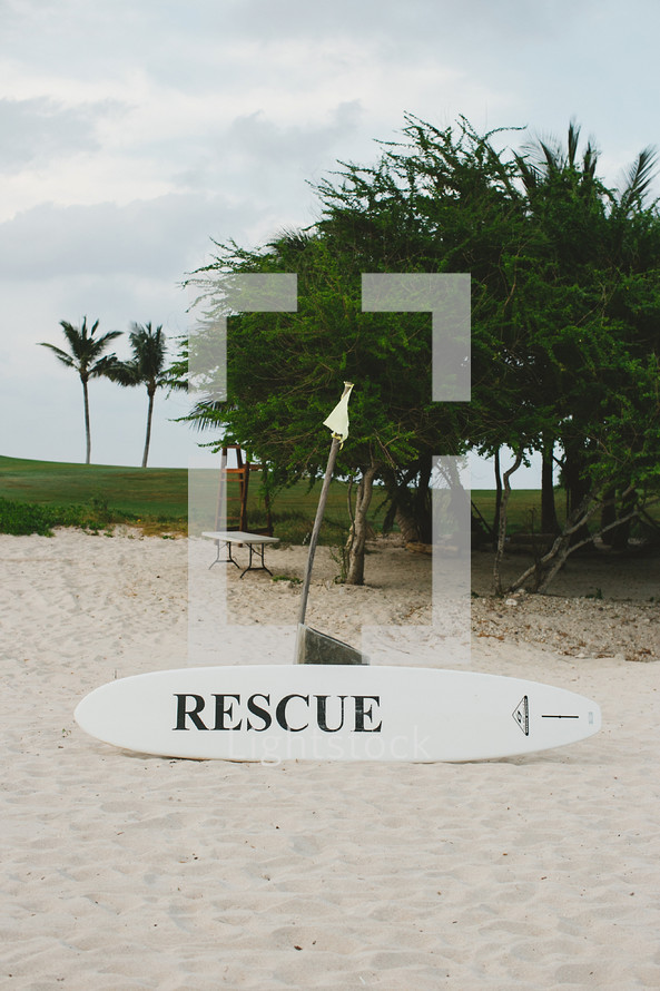 rescue on a surfboard on a beach 