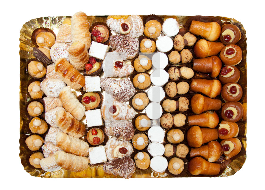 Tray of mixed patisserie on white background