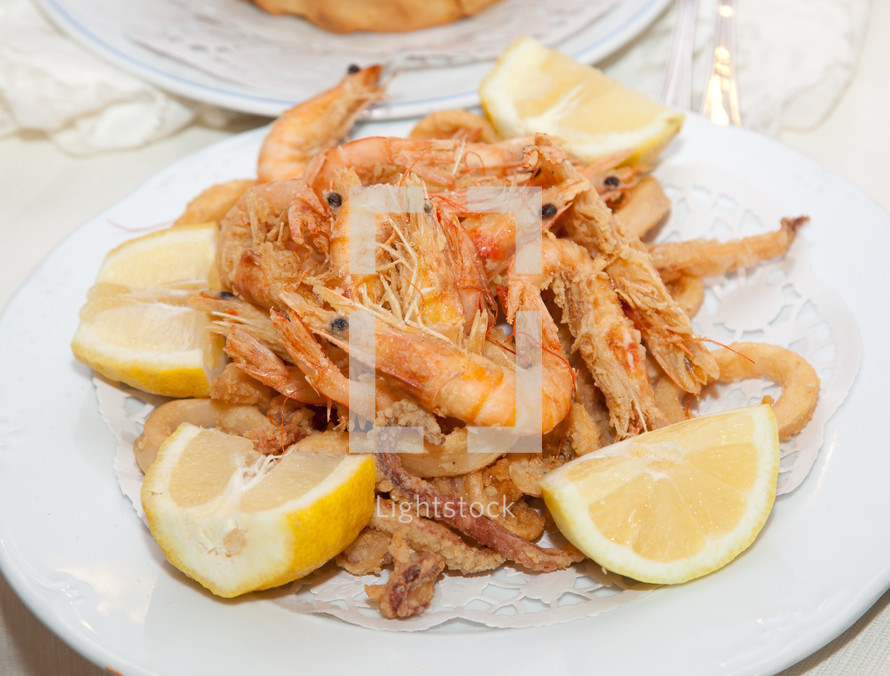 Mixed deep-fried fish shrimp and squid platter.