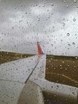 wet glass on a plane window 
