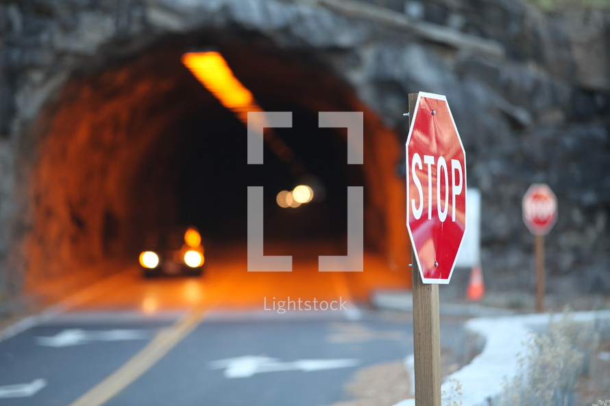 Stop sign by tunnel