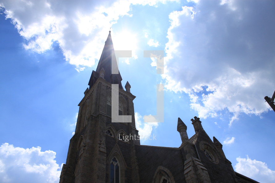 church steeple under the glow of sunlight