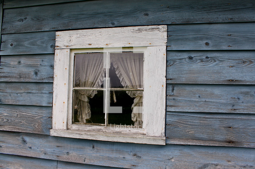 curtains through a small window 