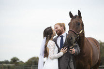 bride and groom with a horse 