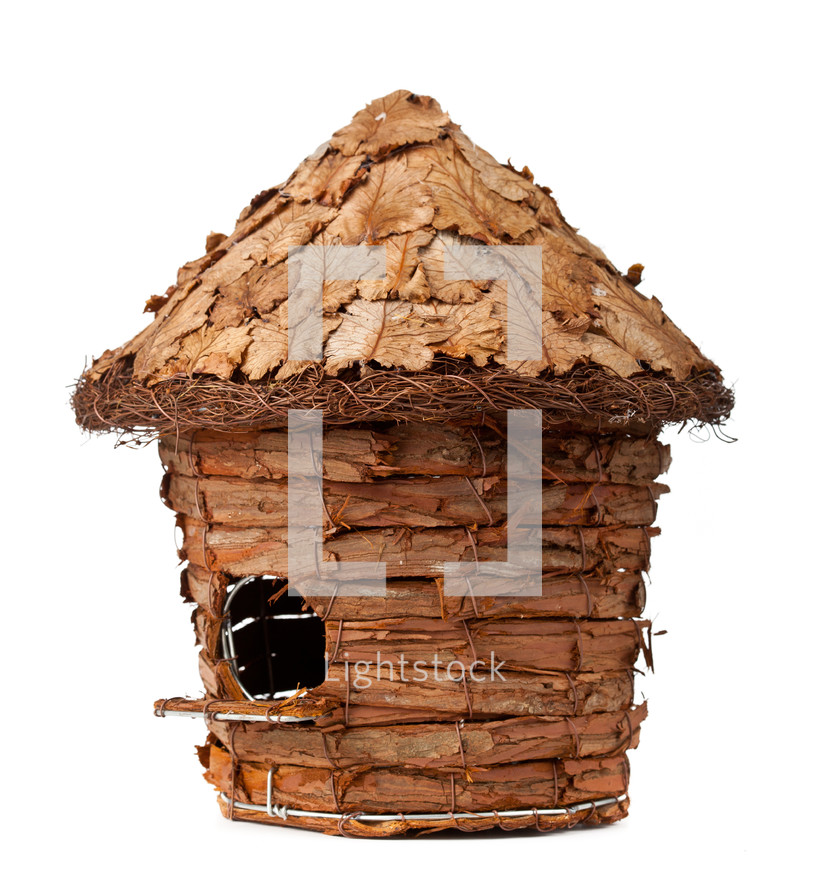 Wooden birdhouse on a white background
