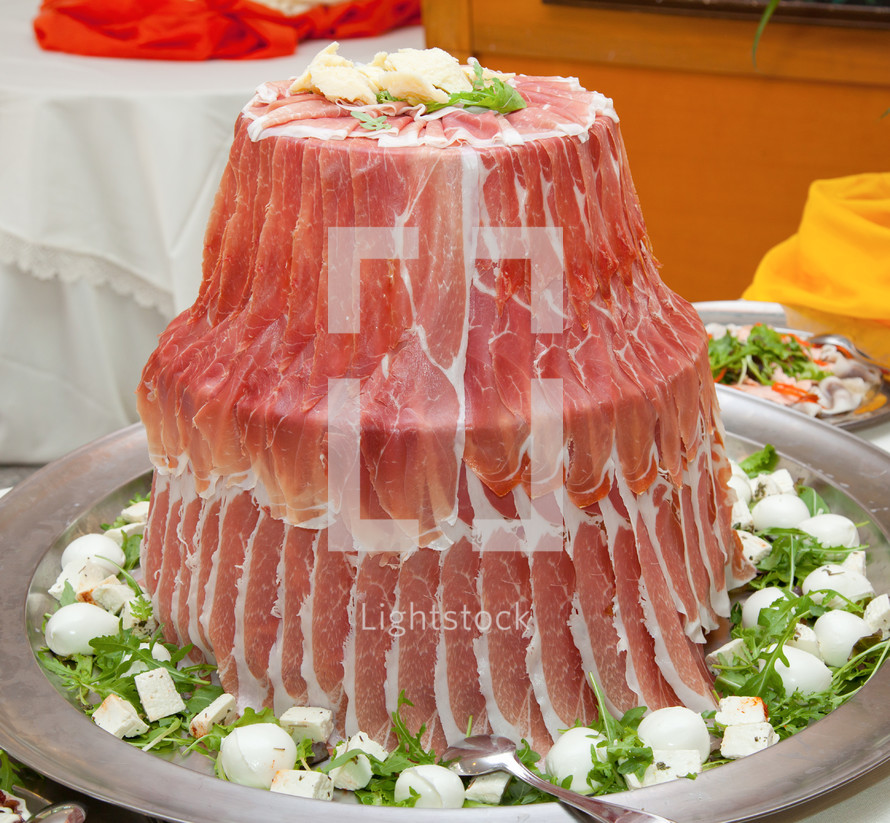 Raw ham arranged like a fountain, Italian buffet.