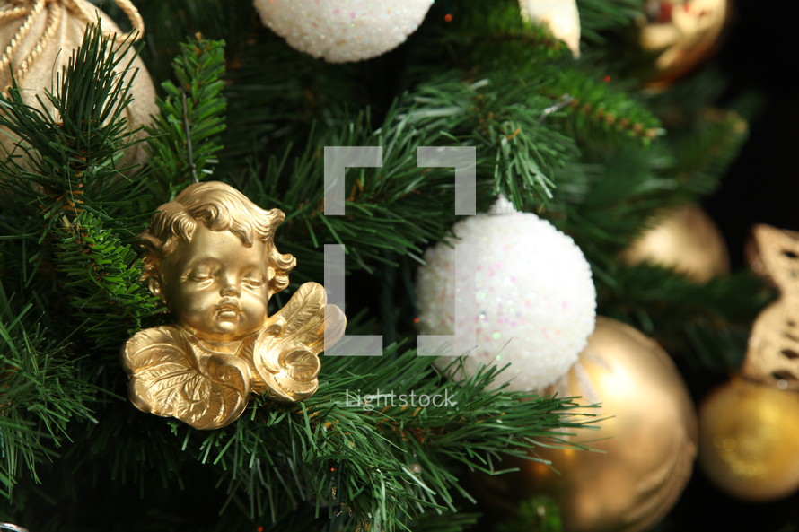 Christmas ball, white and gold on christmas tree
