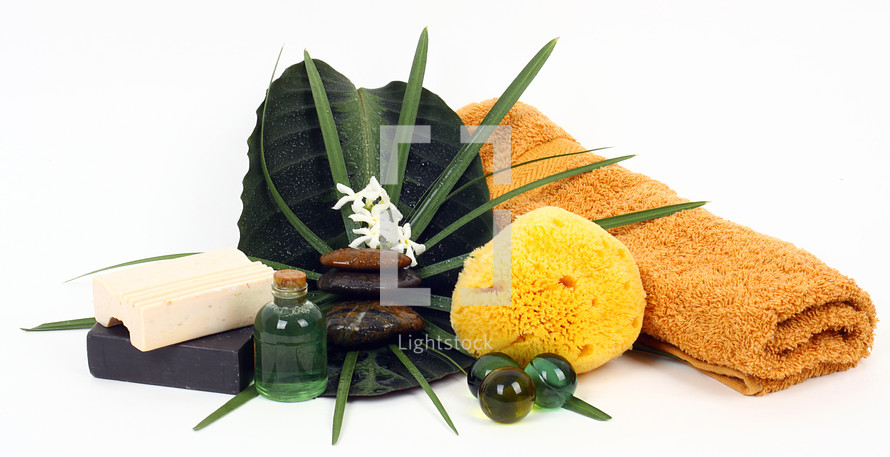 Accessories for spa with flowers of jasmine on white background