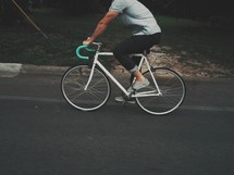 man pedaling a bicycle 