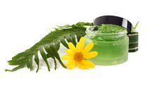 Cosmetics cream in the green jar on white background