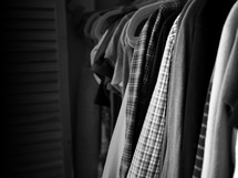 clothes hanging in a closet 