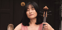 woman playing a cello 