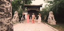 musicians standing in front of a temple 