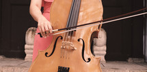 woman playing a cello 