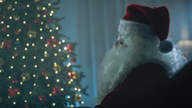 Santa Claus under Christmas Tree