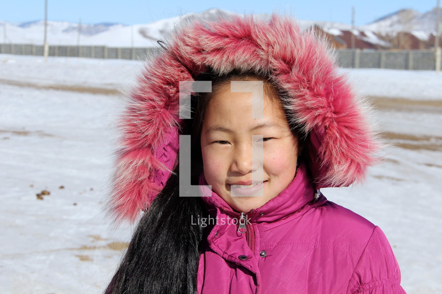 Young Mongolian girl in a winter coat  [For more like this try search Ethnic Faces]
