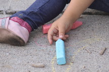 Child's hands with sidewall chalk,
