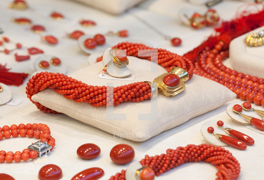 closeup of necklace and coral accessories in jewelry.
