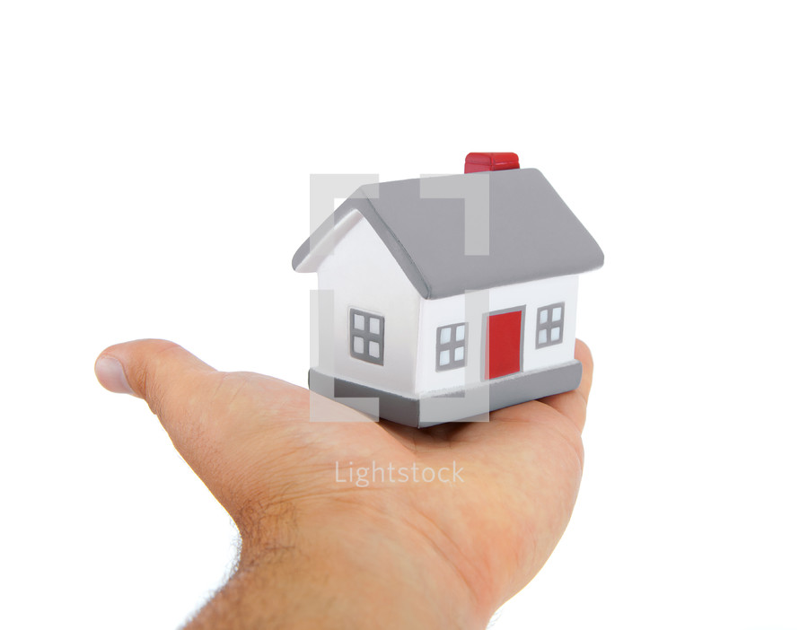 House model toy plastic in hand on white background