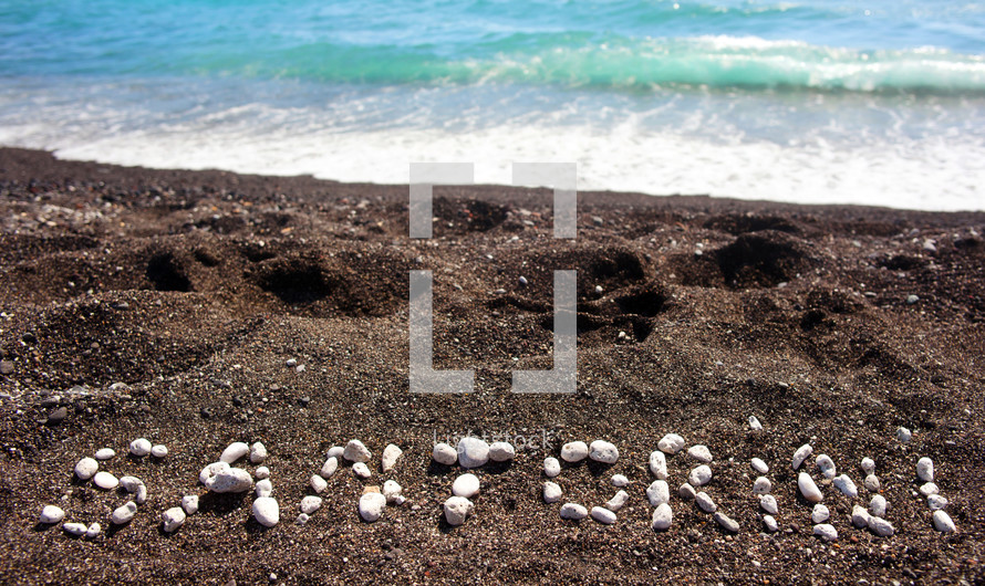 text Santorini made ......with pumice stones on the volcanic beach at Kamari